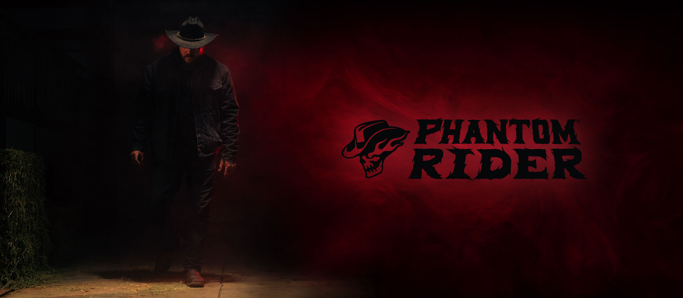 Cowboy standing in the dark with red smoke. Phantom Rider logo.